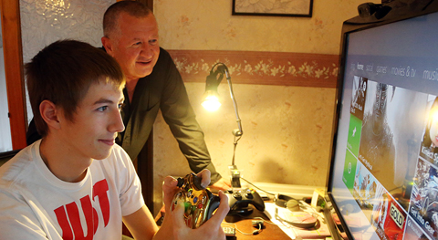 Family playing games on a computer