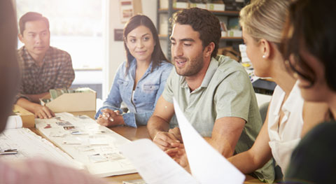 Group of people people sitting around a table