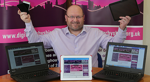 Man with laptops, tablets and mobile phone